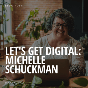 Michelle Schuckman sitting at table on computer