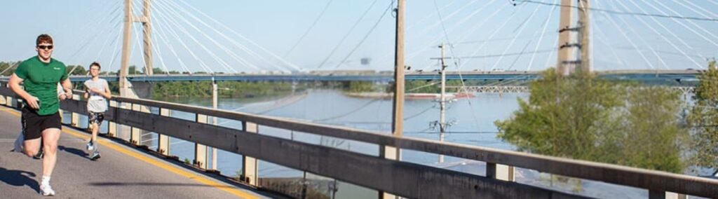 people running on bridge